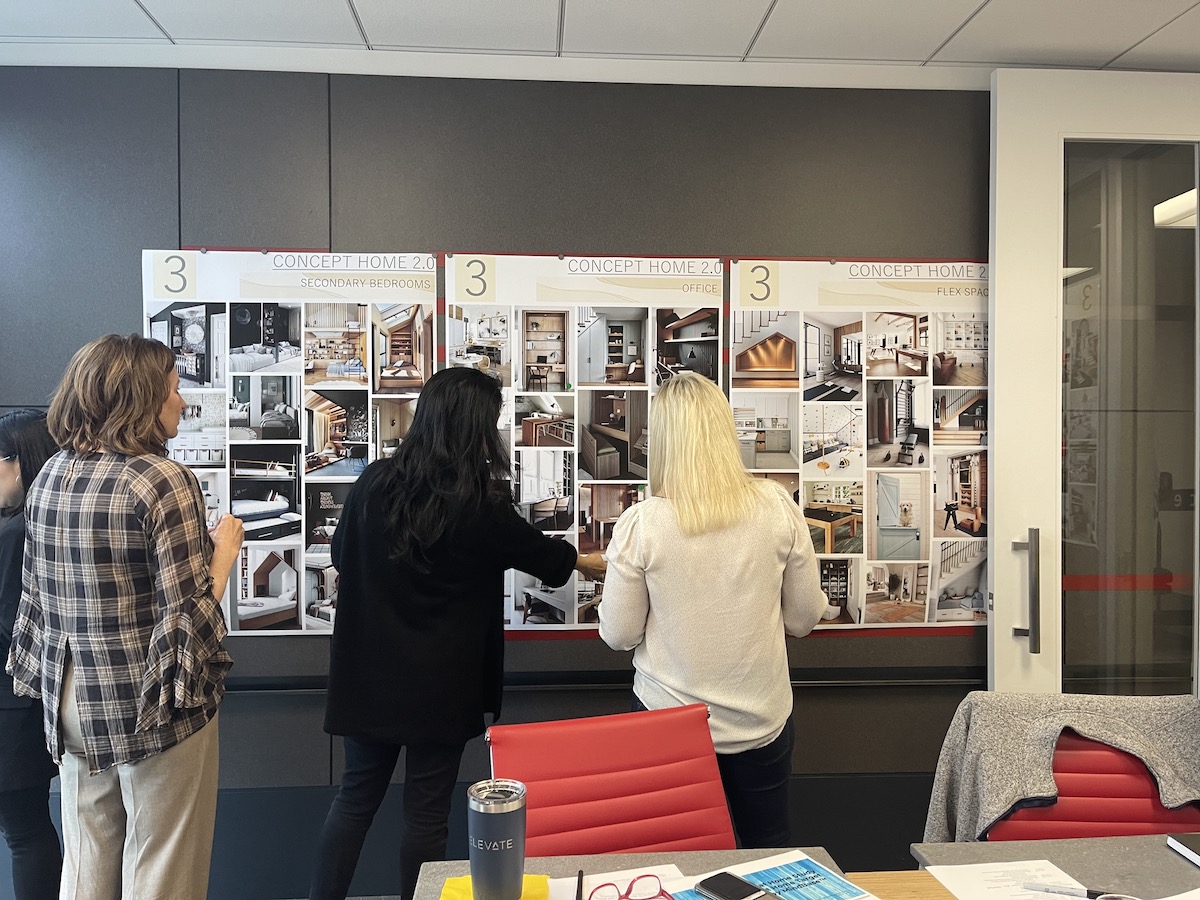Charrette participants review inspiration images for secondary bedrooms, home offices, and flex spaces that will best meet the consumer preferences uncovered in the research.